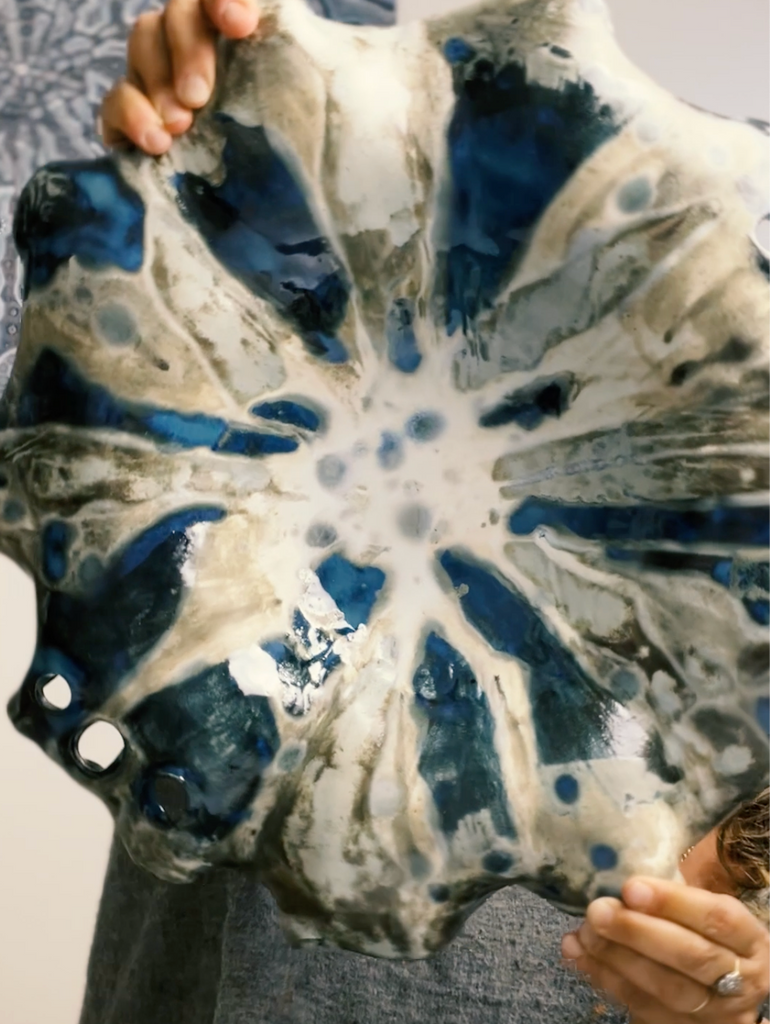 ceramic dish with intricate glazes 
